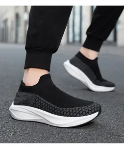 Side view of black flyweave knit sneakers showing breathable mesh and white sole