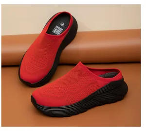 Detailed view of red breathable mesh slip-on shoes featuring a thick black sole
