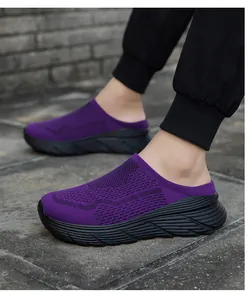 Side detail of purple breathable mesh mule sneakers with thick black platform soles