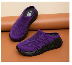 Close-up detail of purple breathable mesh slip-on mule shoes with thick black sole