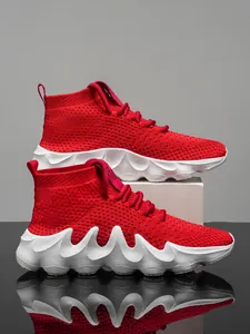 Vibrant red flyknit sports running shoes with thick white wavy soles for trendy men.
