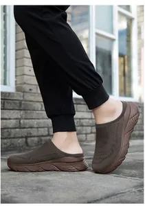 Detailed side view of breathable brown mesh mules with thick soles for outdoor use