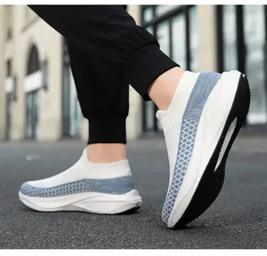 Macro detail of breathable white mesh slip-on sock sneakers with stylish blue pattern
