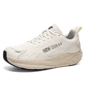 Cream men's running shoes with breathable mesh and thick cushioned sole for athletics.