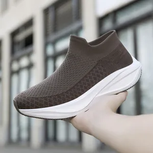 Dark brown fly-knit sock shoes with chunky white sole, slip-on casual design
