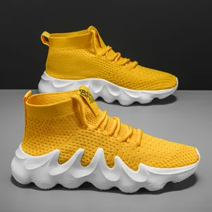 Lightweight breathable yellow fly-knit sneakers for men with unique wavy white sole