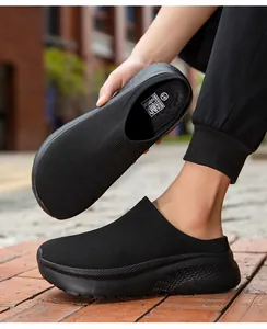 Close-up view of black knit slip-on sock shoes featuring a thick cushioned black sole