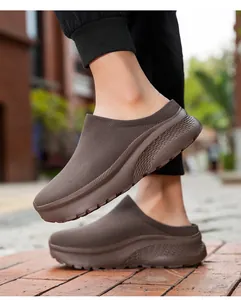 Side view of brown knit sock mule featuring a thick platform sole with textured patterns