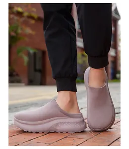 Close-up side view of mauve knit slip-on mules with thick textured soles on model
