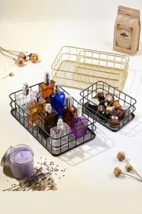 Close-up of black and gold metal wire storage baskets in a lifestyle setting