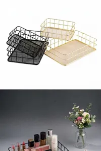 Macro detail of a gold wire mesh organizer basket filled with various makeup products