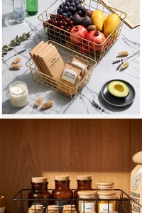 Close-up of gold and black wire storage baskets for fruits and kitchen spices.