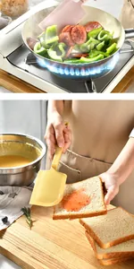 Detailed view of heat-resistant silicone spatula stir-frying and spreading jam on toast.