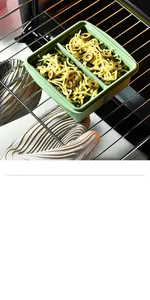 Detail shot of a green food-grade silicone lunch box being heated on an oven rack