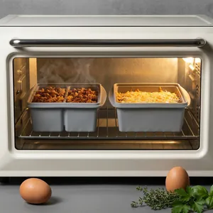 Grey silicone freezer food storage containers shown heating inside a white modern oven