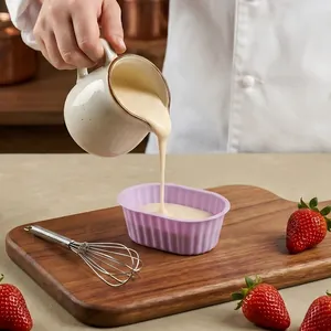 Small oval silicone cheesecake mold for baking reusable dessert cups in a kitchen setting