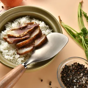 High quality titanium rice spoon with ergonomic acacia wood handle served with white rice