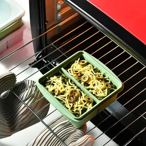 Two-compartment silicone food storage container and oven mold used for freezing soup cubes