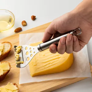 Handheld 2-in-1 stainless steel cheese slicer and grater with herb stripper for kitchen use