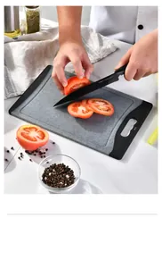 Close-up view of non-slip PP chopping board in use for slicing fresh red tomatoes