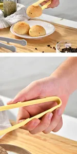 Vue détaillée de la pince alimentaire mignonne en silicone patte de chat ramassant des pâtisseries