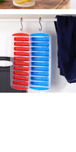 Close-up detail of colorful stick ice cube trays hanging on a modern kitchen rack