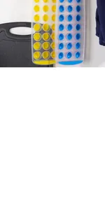 Close-up detail of 21-hole round ice cube trays in yellow and blue kitchen setup.
