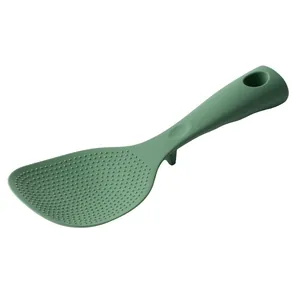 Non-stick green silicone rice spoon with standing base and heat resistant handle