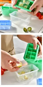 Close-up of flexible silicone ice cube tray releasing lime-infused cubes into a box