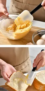 Detail view of a silicone spatula spreading butter on toast and mixing batter in a bowl.