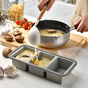 Three-grid silicone freezer storage tray with lid and integrated volume measurement marks.