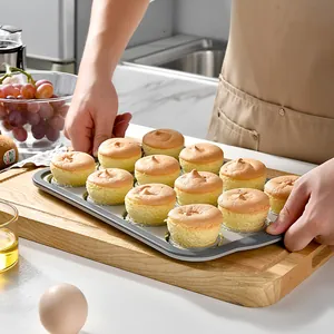 Professional 12-cup silicone cupcake baking pan with freshly baked muffins in kitchen