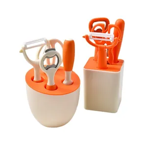 5-piece orange and white kitchen tool set with peeler and bottle opener