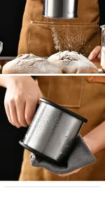 Stainless steel flour sifter detail showing the fine mesh sifting powder on bread.