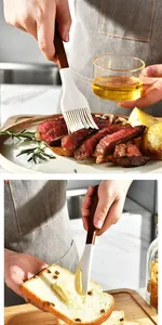 Detailed view of silicone brush and spatula used for basting steak and spreading butter