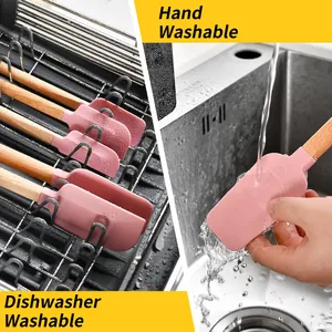 Pink silicone spatulas with wooden handles, dishwasher safe for easy kitchen cleaning