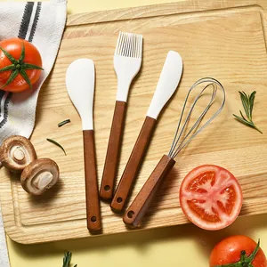 Premium 4-piece silicone baking tool set with wooden handles on a wooden cutting board