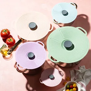 Universal spill-proof silicone lids set in pastel colors for various kitchen pot sizes.