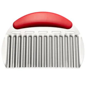 Professional stainless steel crinkle cutter with red ergonomic handle for potato and veggies