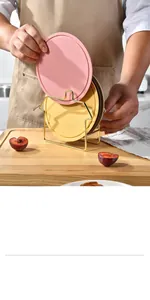 Premium colorful round heat-resistant silicone mats organized in a gold metal storage rack
