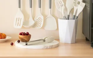 White silicone kitchen utensil set in a modern lifestyle kitchen setting