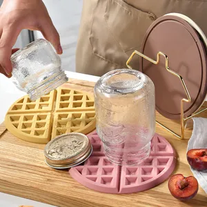 Heat-resistant silicone waffle-textured trivet mats for table protection
