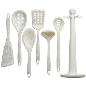 Set di 7 utensili da cucina in silicone bianco crema maculato con supporto rotante incluso