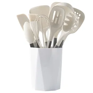 11-piece cream heat-resistant silicone kitchen utensil set with white storage holder