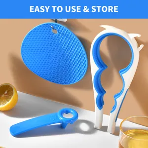 Close-up of 3-piece kitchen set including jar opener, bottle opener, and silicone pad