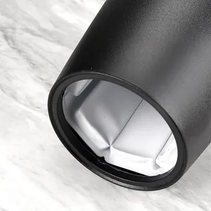 Portable black wine cooler bucket for fast champagne cooling shown on marble surface
