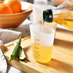 Semi-transparent silicone measuring cup with red scale markings for precise baking