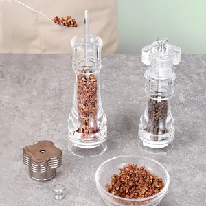 Clear acrylic manual pepper grinders for salt and spices in kitchen
