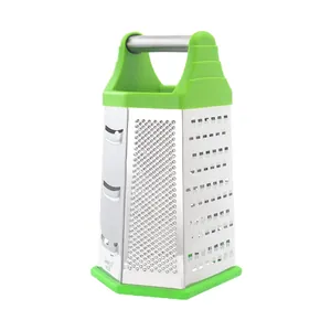 Six-sided stainless steel box grater with green non-slip base and ergonomic handle for food.