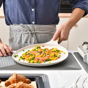Gray silicone heat resistant mat with non-slip ripple design for kitchen counter